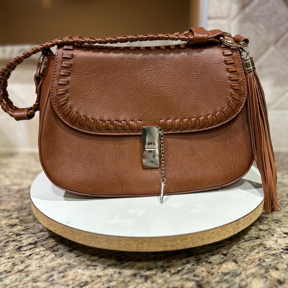 Brown fringe Lionel purse with gold tone slide pin closure